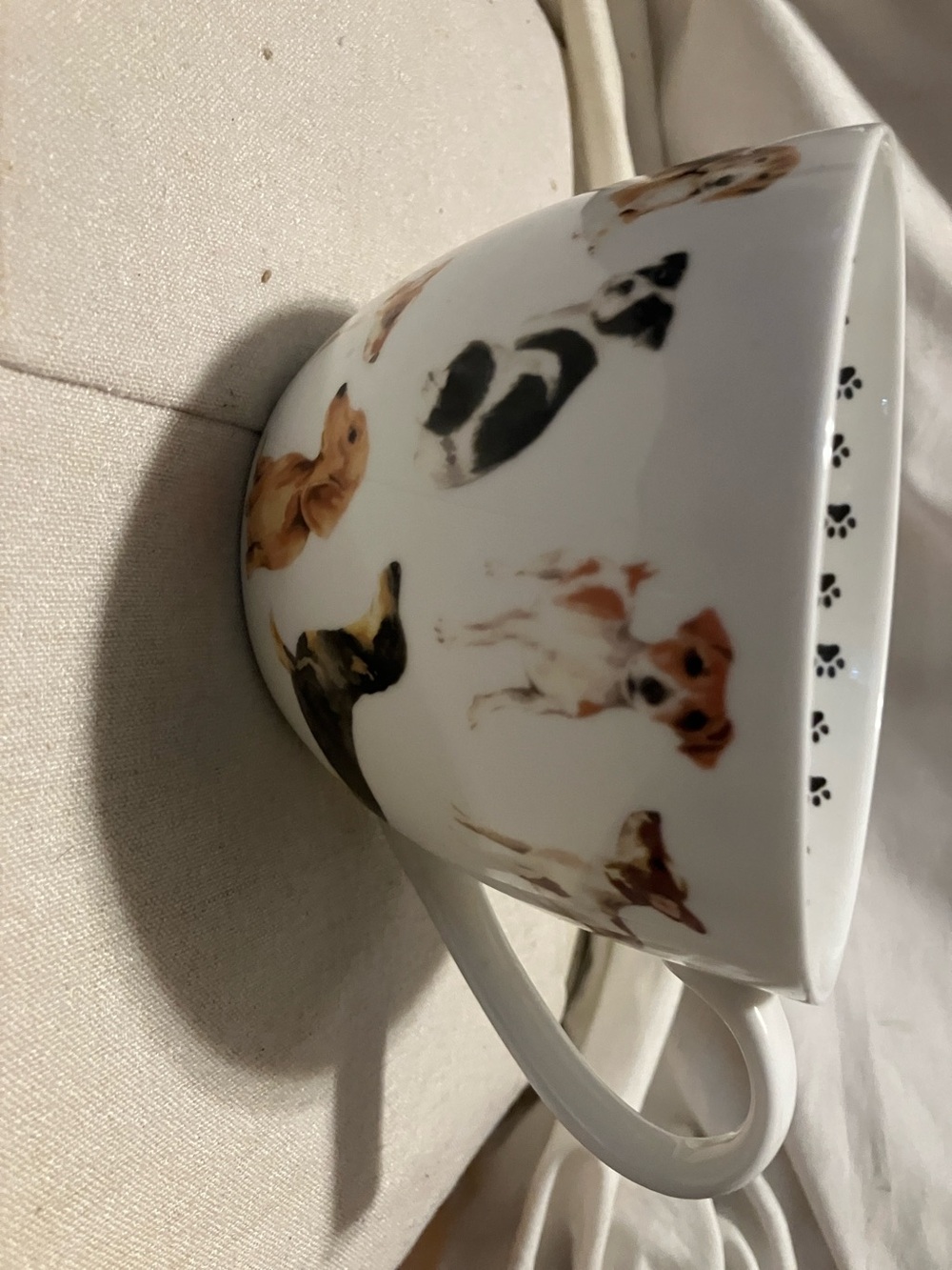 Like new. Jumbo size coffee or soup mug embellished with many dogs n paws